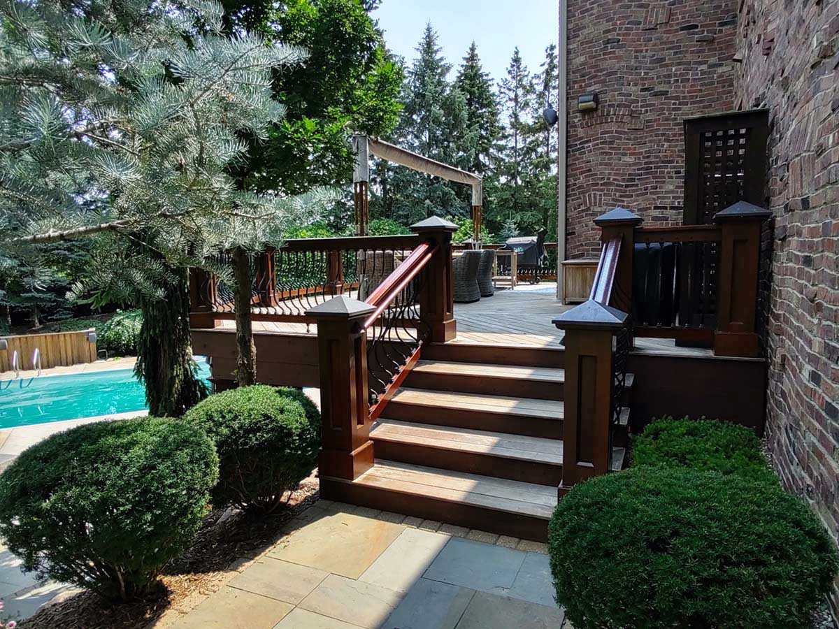 Refinished home exterior and deck by Graham Nunn Painting